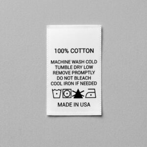Custom cotton care label with wash instructions and care symbols for garments